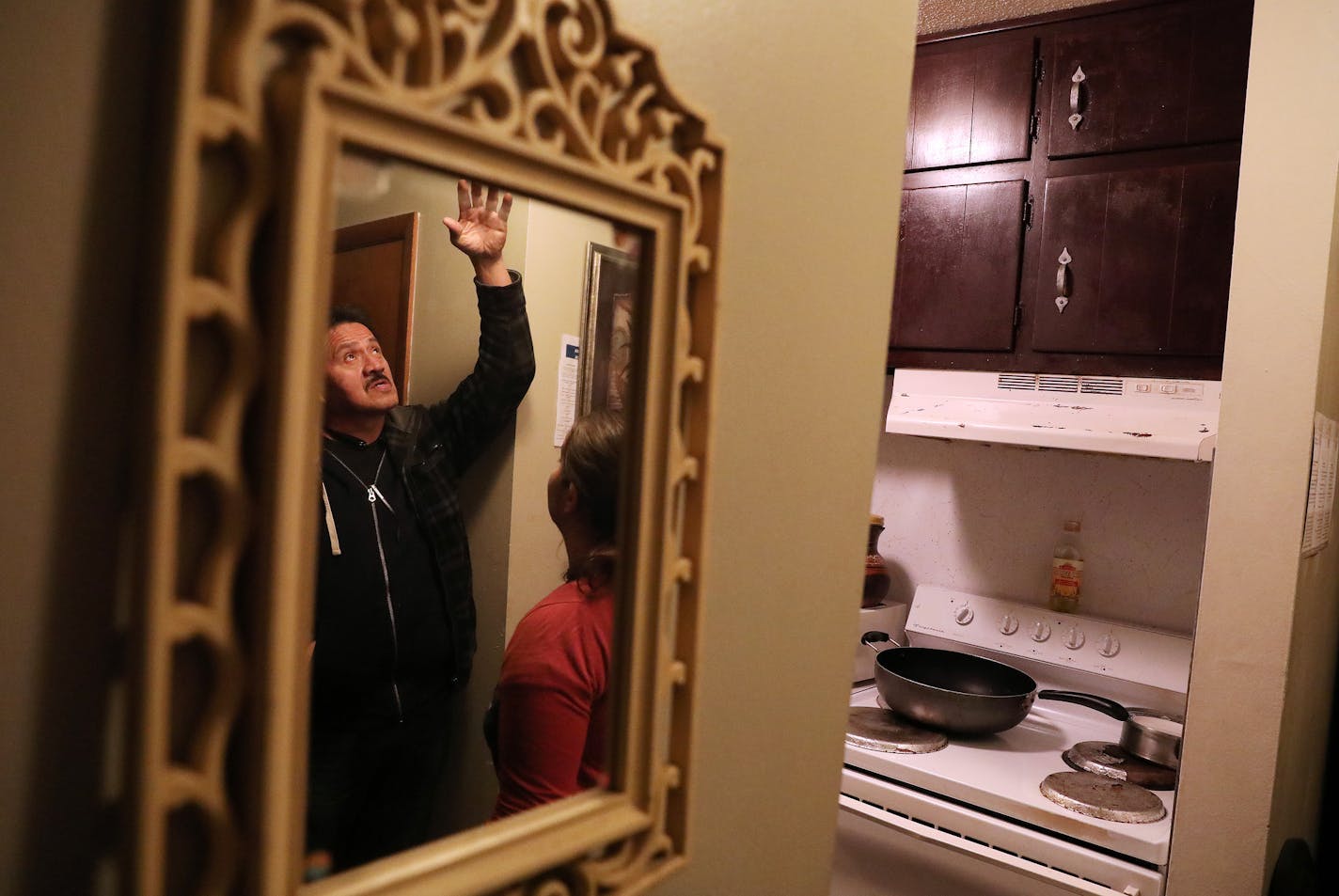 Jose Ramirez talks with Arianna Feldman, an organizer with United Renters for Justice, about the water that leaks from the light fixture in the entryway of his apartment. He says the oven at right randomly turns on despite his requests to the landlord that it be fixed. ] ANTHONY SOUFFLE &#x2022; anthony.souffle@startribune.com Jose Ramirez and his wife live in an apartment building owned by landlord Stephen Frenz who the city is trying to strip of all his rental licenses. The Ramirez's roof leak