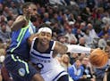 Wolves guard D'Angelo Russell was guarded by the Mavericks' Tim Hardaway Jr. in the first half in Dallas on Monday night.