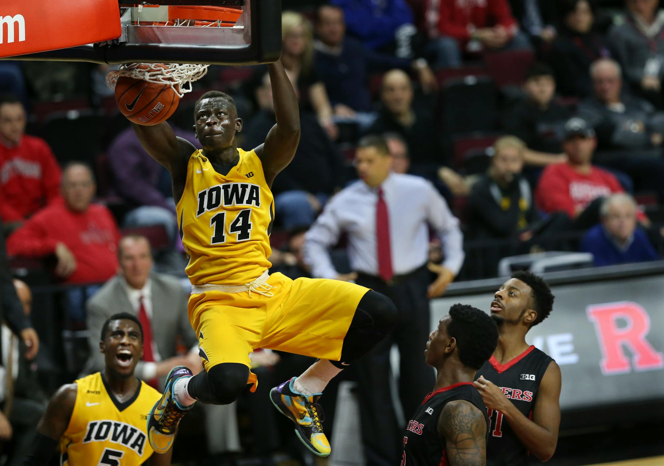 Iowa guard Peter Jok (14) dunks a basket during the first half of an NCAA college basketball game against Rutgers, Thursday, Jan. 21, 2016, in Piscataway, N.J. (AP Photo/Mel Evans)