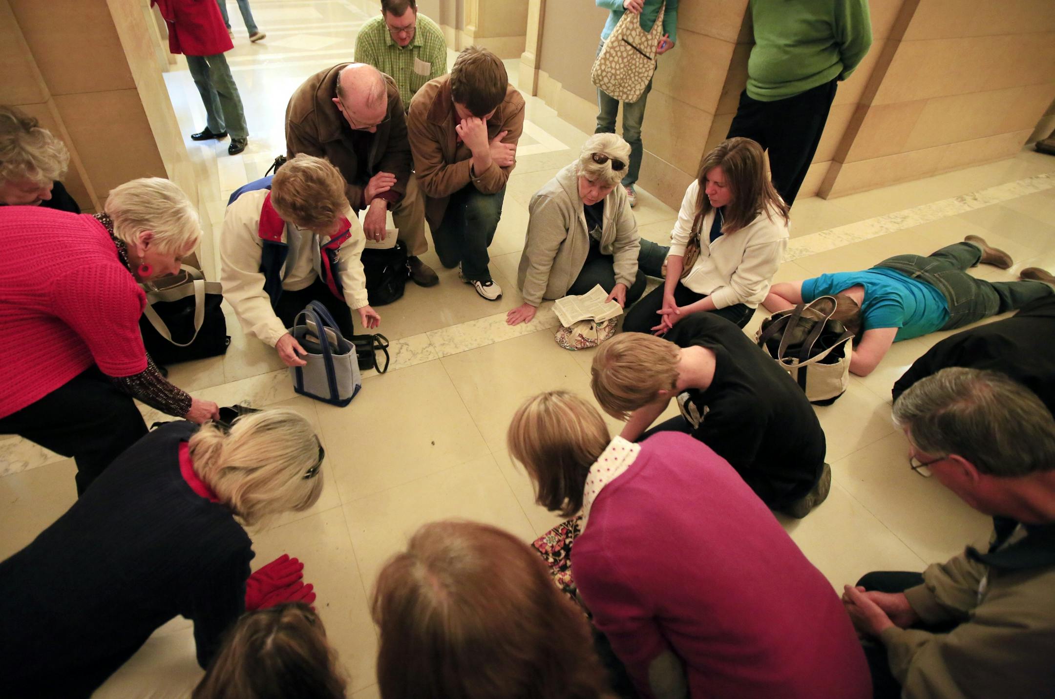 A group opposed to same-sex marriage prayed before Minnesota Senate voted to approve legalization of gay marriage.