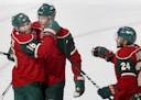 Jason Zucker (16) and Mikko Koivu (9) celebrated goal by Koivu in the second period.