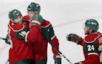 Jason Zucker (16) and Mikko Koivu (9) celebrated goal by Koivu in the second period.