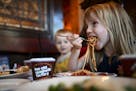 Etta Martin, 4, of Minneapolis, ate a heaping fork-full of spaghetti while dining with her little brother, Xavier, 2, and parents at The Old Spaghetti