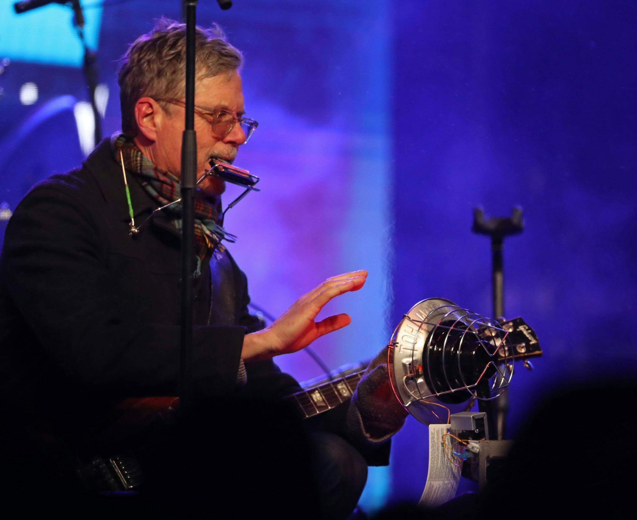 Lead singer Gary Louris of The Jayhawks warmed his hands at a heater between songs during Super Bowl LIVE on Nicollet Mall on Saturday, Feb. 3, 2018.