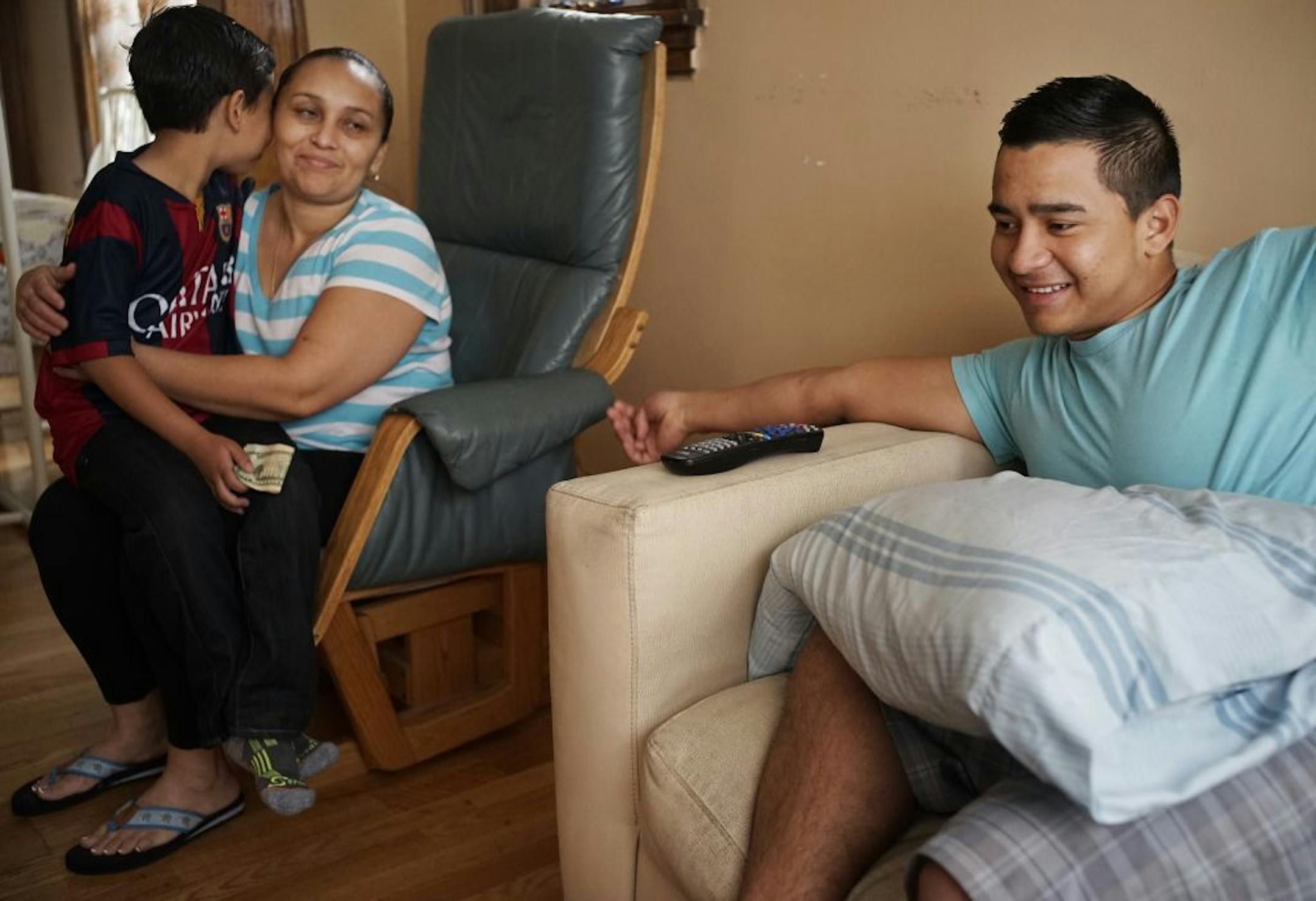 Elder Leiva,17, gets a lot of support from his aunt Mary Evelyn Leiva and his cousin Eulises, 9, with whom he shares a room.