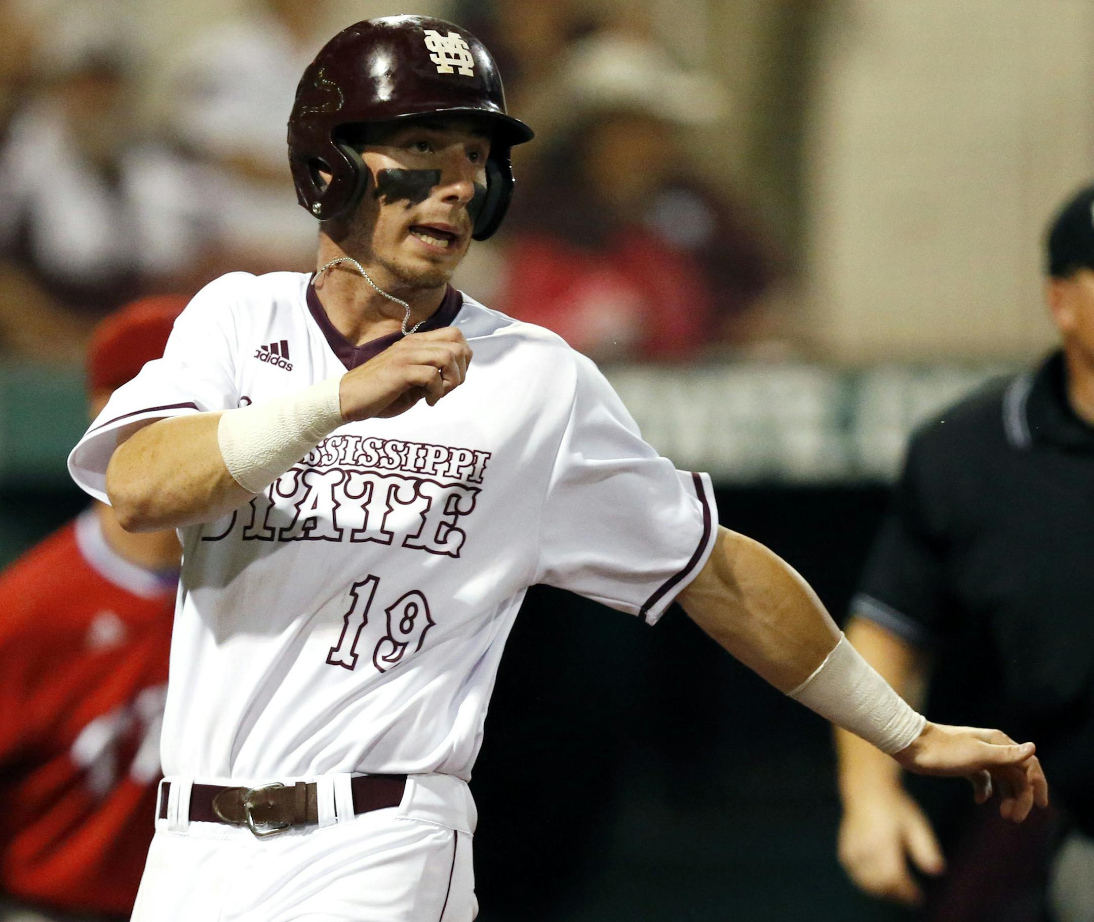 Mississippi State's Brent Rooker (19) looks around after scoring on a second inning fielder's choice during their NCAA Regional Baseball Tournament game against Louisiana Tech at Dudy Noble Field in Starkville, Miss., Sunday, June 5, 2016. (AP Photo/Rogelio V. Solis) ORG XMIT: MSRS128