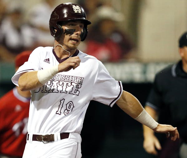 Mississippi State's Brent Rooker (19) looks around after scoring on a second inning fielder's choice during their NCAA Regional Baseball Tournament ga