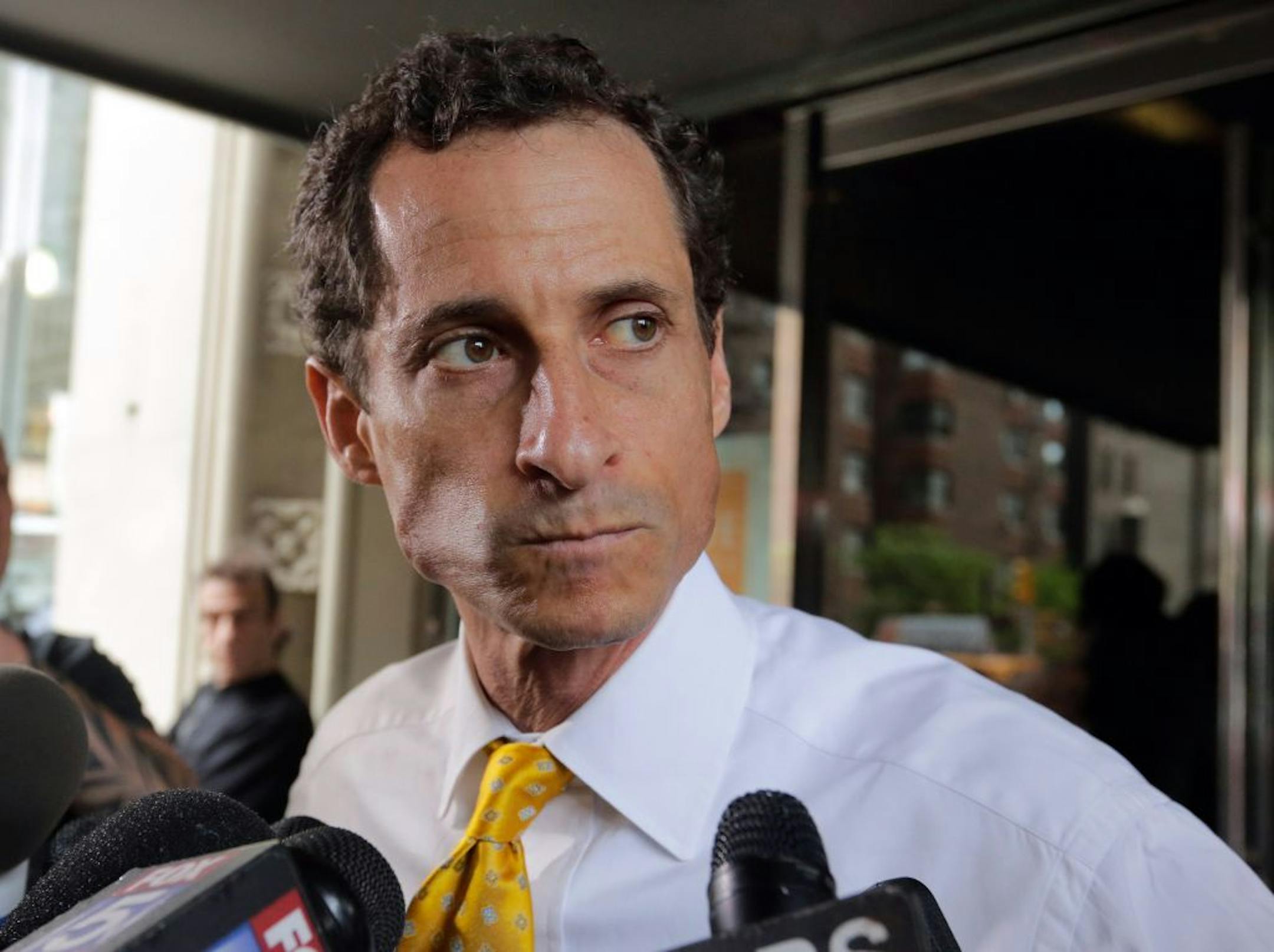 Former U.S. Congressman and current New York mayoral candidate Anthony Weiner leaves his apartment building, in New York, Wednesday, July 24, 2013. On Tuesday Weiner made a public mea culpa for a newfound sexting scandal that erupted amid the mayoral run he hopes will rewrite his political future.