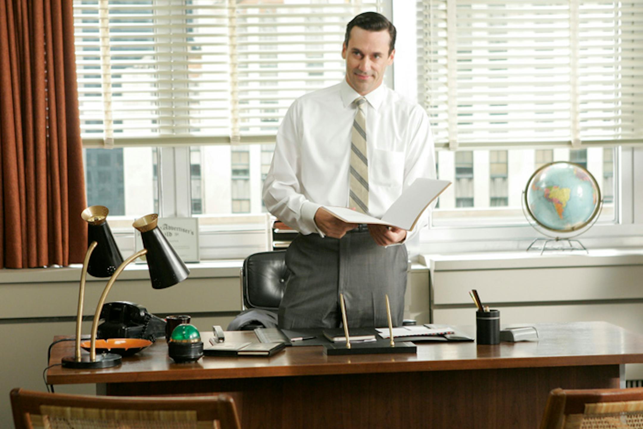 Don Draper (Jon Hamm) heads the meeting with the advertising men.