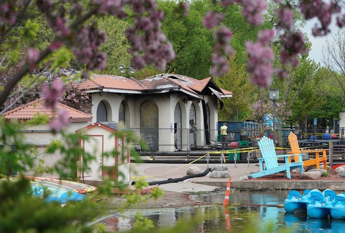 A day and a half after fire gutted the lakeside pavilion that housed Lola on the Lake, people still stopped to look at the destruction as inspectors continue to decide if the structure can be restored or if it will have to be demolished. Photographed Friday, May 17, 2019 at Lake Calhoun/Bde Mka Ska in Minneapolis, Minn.