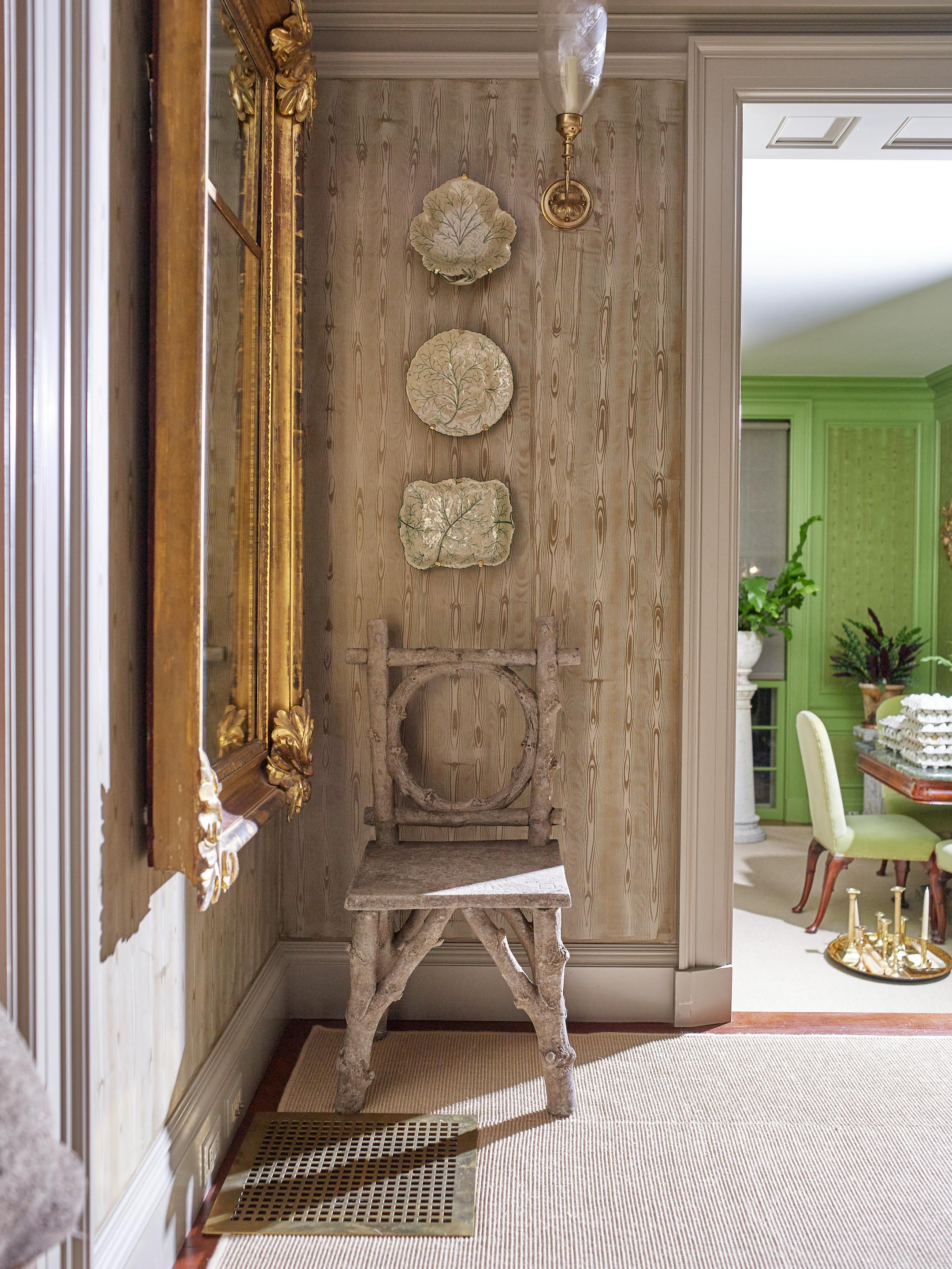 BC-ASK-MARTHA-BEDFORD-INTERIORS-ART-NYTSF — Martha and Kevin Sharkey spruced up a spare corner in the front hall with a faux-bois chair she's always loved, which also echoes the hand-painted walls. (Pieter Estersohn/Martha Stewart Living Online) — ONLY FOR USE WITH ARTICLE SLUGGED — BC-ASK-MARTHA-BEDFORD-INTERIORS-ART-NYTSF — OTHER USE PROHIBITED.