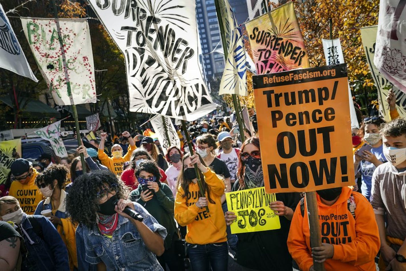 People urge for all votes to be counted as they demonstrate outside the Pennsylvania Convention Center where votes are being counted, Friday, Nov. 6, 2020, in Philadelphia.