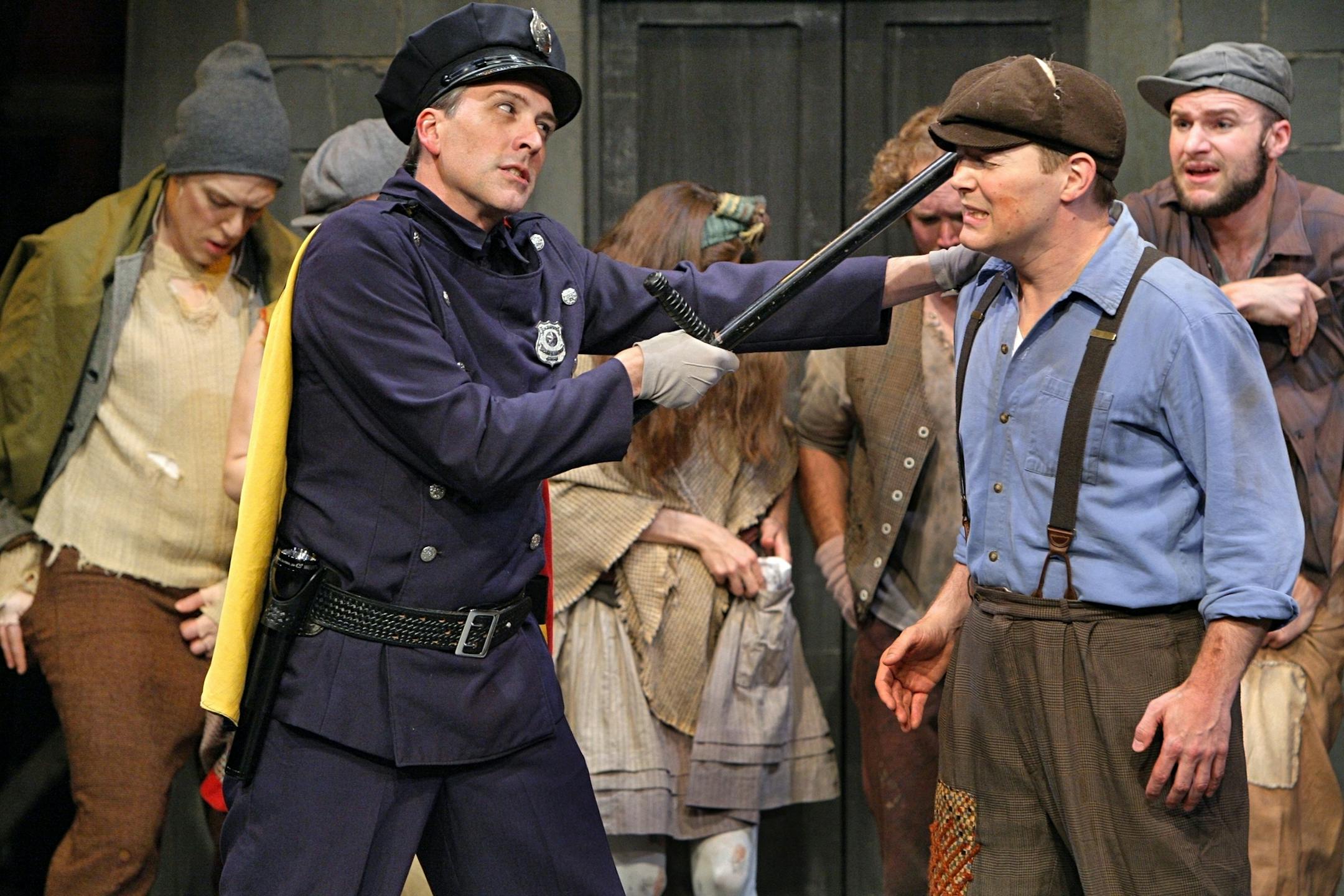 Urinetown , by Jungle Theater (L-R) Officer Lockstock (Bradley Greenwald) and Bobby Strong (Patrick Morgan) with URINETOWN company PHOTO CREDIT: Michal Daniel ORG XMIT: MIN1306071509263989