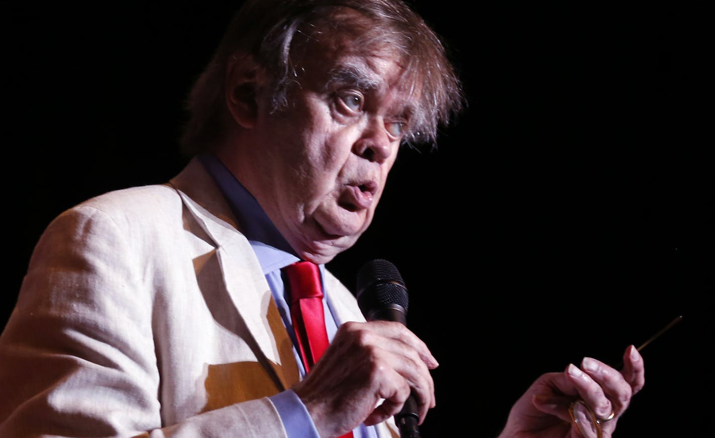 In this May 21, 2016 photo, Garrison Keillor appears during a live broadcast for "A Prairie Home Companion" at the State Theatre in Minneapolis. Keillor said Wednesday, Nov. 29, 2017, he has been fired by Minnesota Public Radio over allegations of improper behavior. (Leila Navidi/Star Tribune via AP)