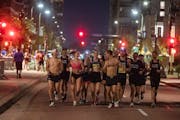 Runners warmed up and and decided to run their own racet the start of the 10-mile in Minneapolis, Minnesota, on Sunday, Oct. 1, 2023. The Twin Cities 