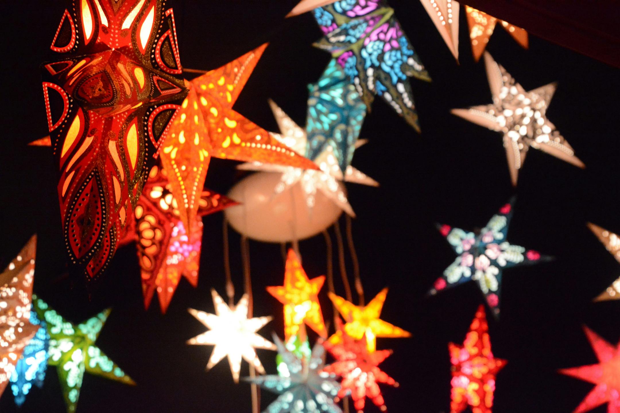 Handmade paper lanterns add sparkle — and entice holiday shoppers — at the Alexanderplatz Christmas market in Berlin.