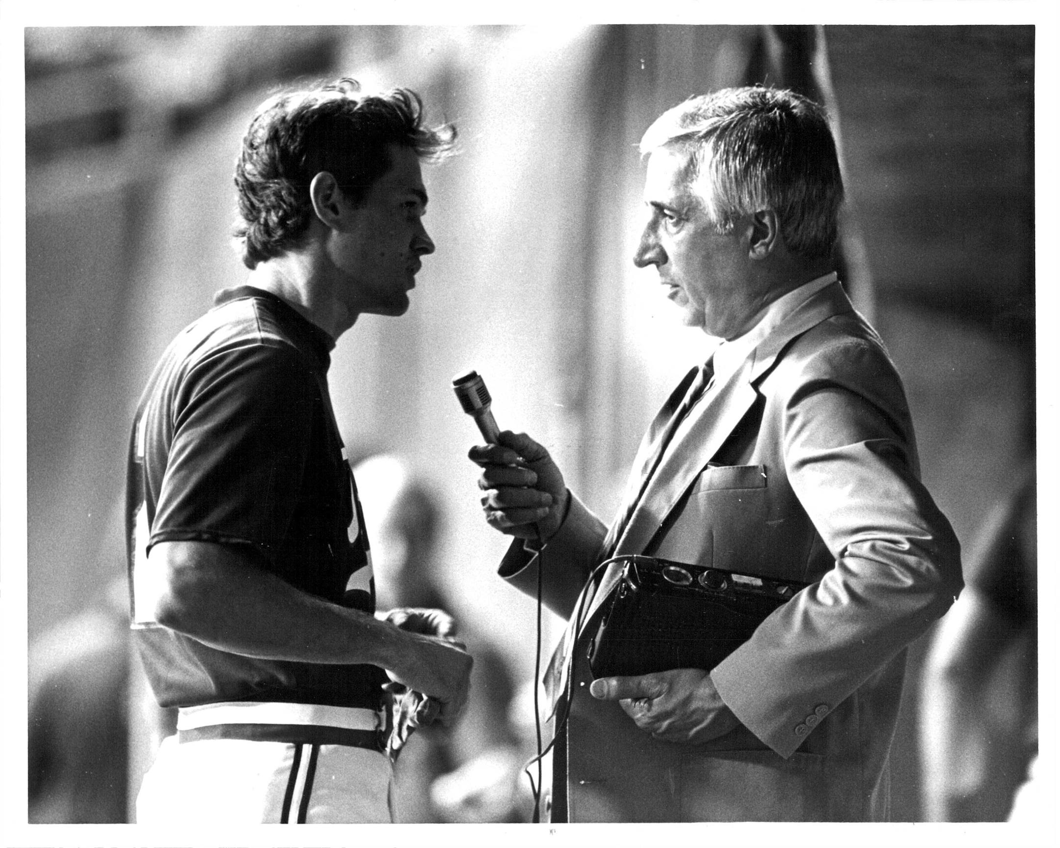 Star Tribune sports columnist Sid Hartman (interviewing the Twins' John Castino)