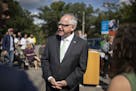 Governor Tim Walz spoke during a press conference Kaposia Park about his plan to have Minnesota adopt California stricter fuel efficiency stadards.