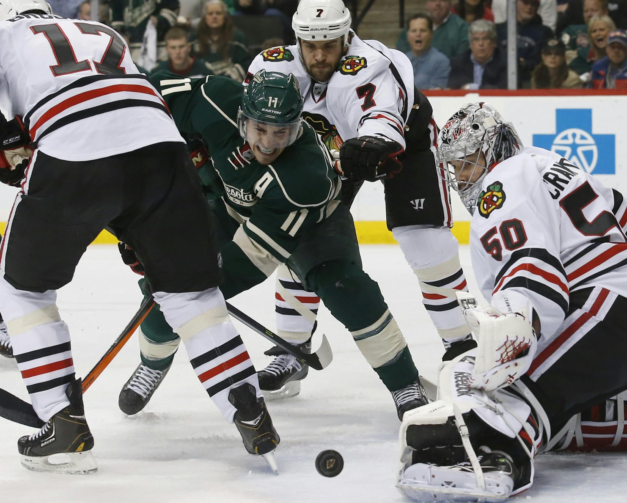 Minnesota Wild left wing Zach Parise (11) fought to get passed the Blackhawk defense and Chicago Blackhawks goalie Corey Crawford (50) during the first period. ] CARLOS GONZALEZ cgonzalez@startribune.com - May 13, 2014, St. Paul, Minn., Xcel Energy Center, NHL, Minnesota Wild vs. Chicago Blackhawks, Stanley Cup Playoffs Round 2, Game 6
