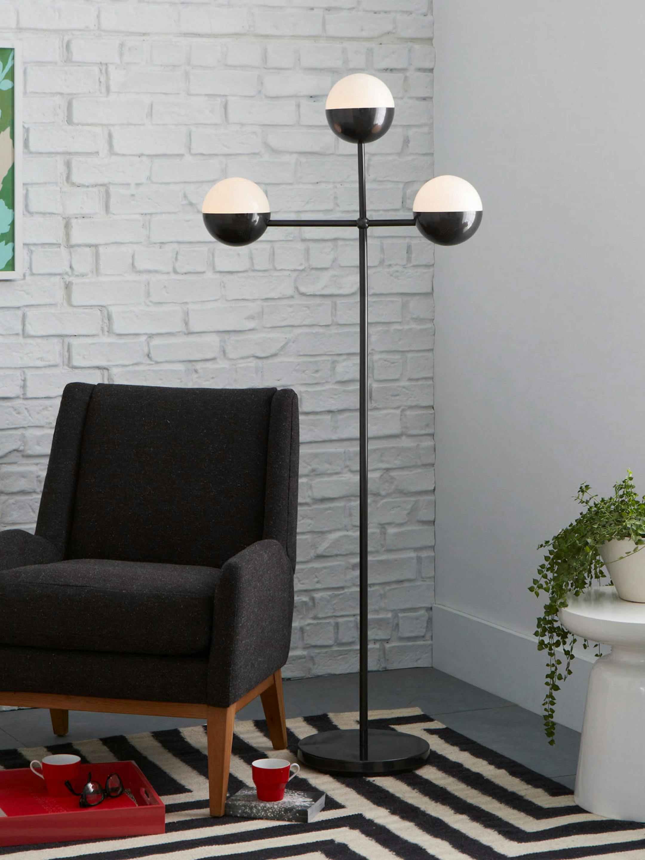 For brightness in a room without an overhead light source, try the Globe Floor Lamp, part of Kate Spade Saturday&#xed;s new line for West Elm ($349). Illustrates FLOORLAMPS (category l), by Lindsey M. Roberts, special to The Washington Post. Moved Wednesday, March 04, 2015. (MUST CREDIT: West Elm.)
