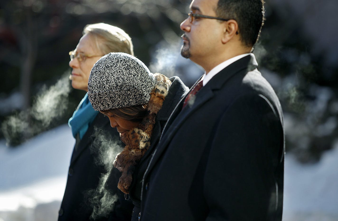 Minnetonka resident Kissy Mason, center, who was denied a job from Target, stood between State Representative Raymond Dehn, left, and President of the St. Paul Branch of the NAACP Jeffrey Martin, for a press conference at the Hennepin County Government Center Plaza, Wednesday, February 20, 2013. TakeAction protested Target's hiring policies and file an EEOC complaint.