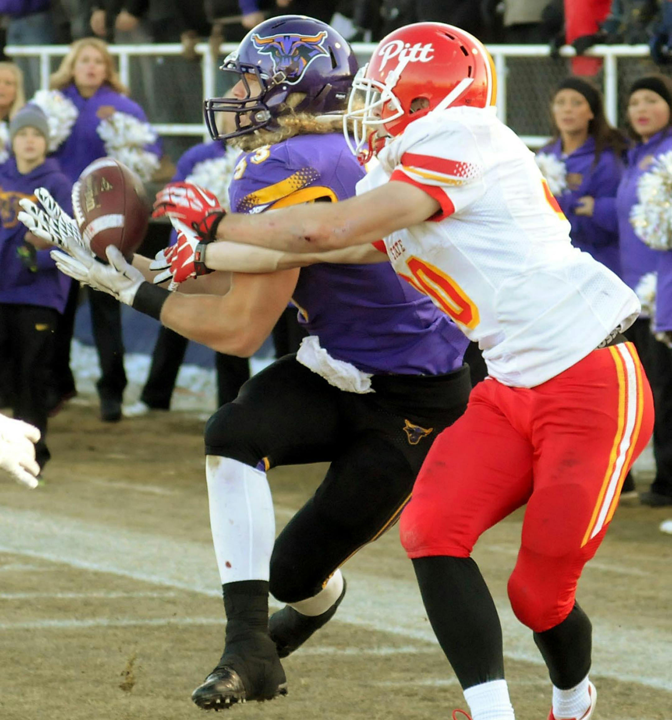 Minnesota State's Tyler Henderson gets in front of Pittsburg receiver Michael Rose to make a game-winning interception at the goal line to win the game for the Mavericks in overtime at MSU's Blakeslee Field on Saturday. Photo by John Cross
