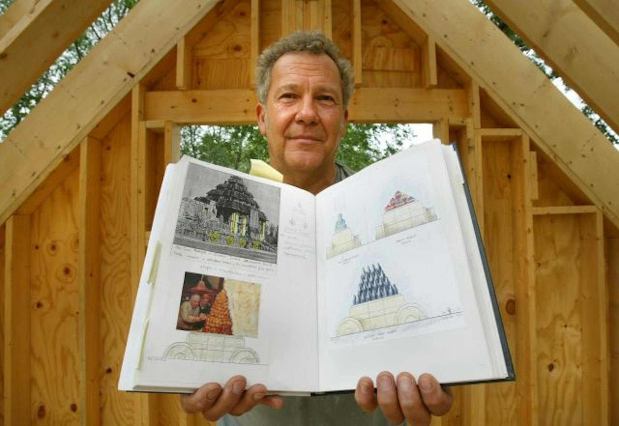 Andrew Leicester holds an artist journal he has been keeping on a recent public sculpture he designed for San Jose, Cal.
