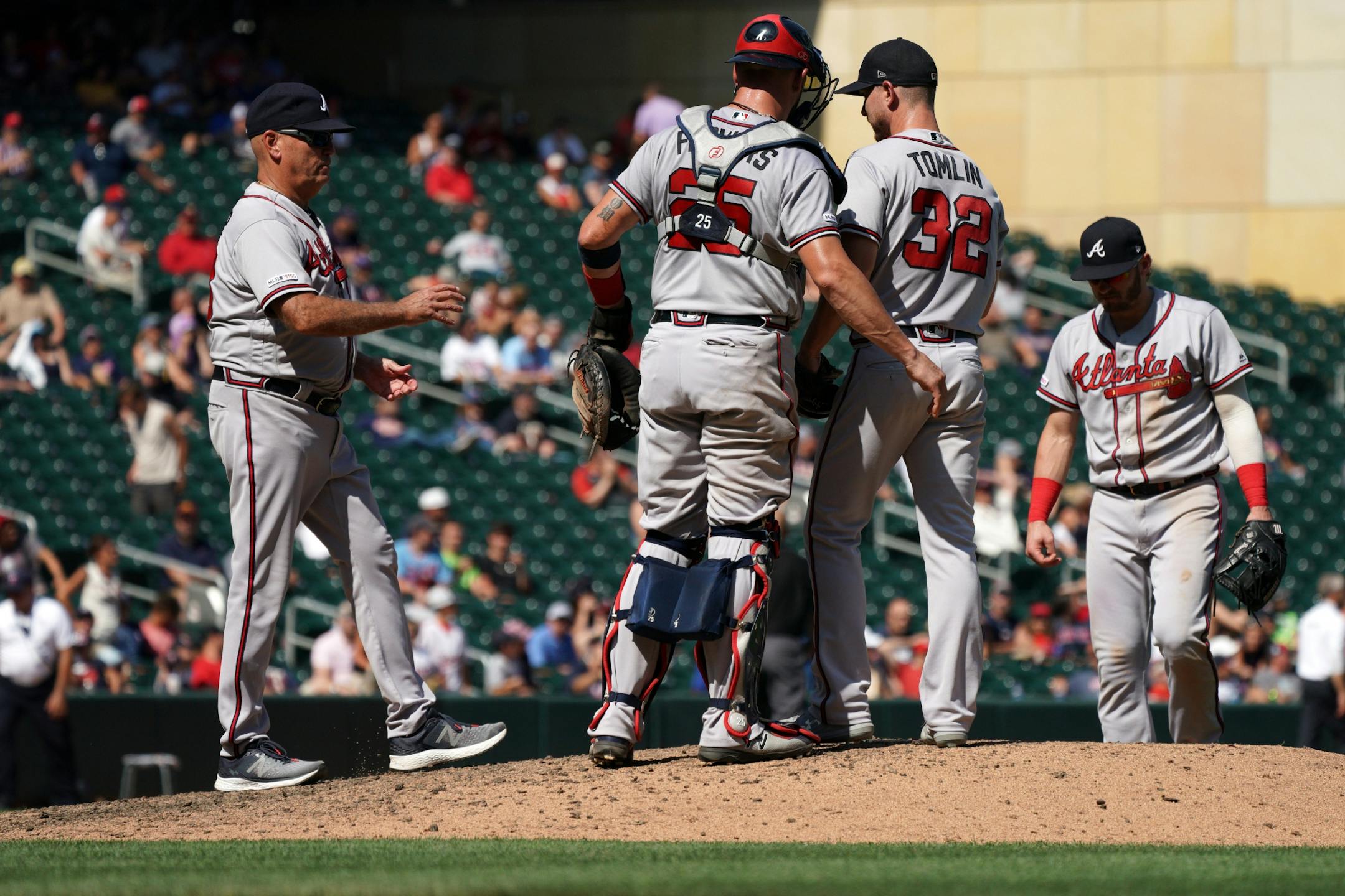 Atlanta Braves relief pitcher Josh Tomlin (32) was pulled from the game with one out left in the ninth inning.