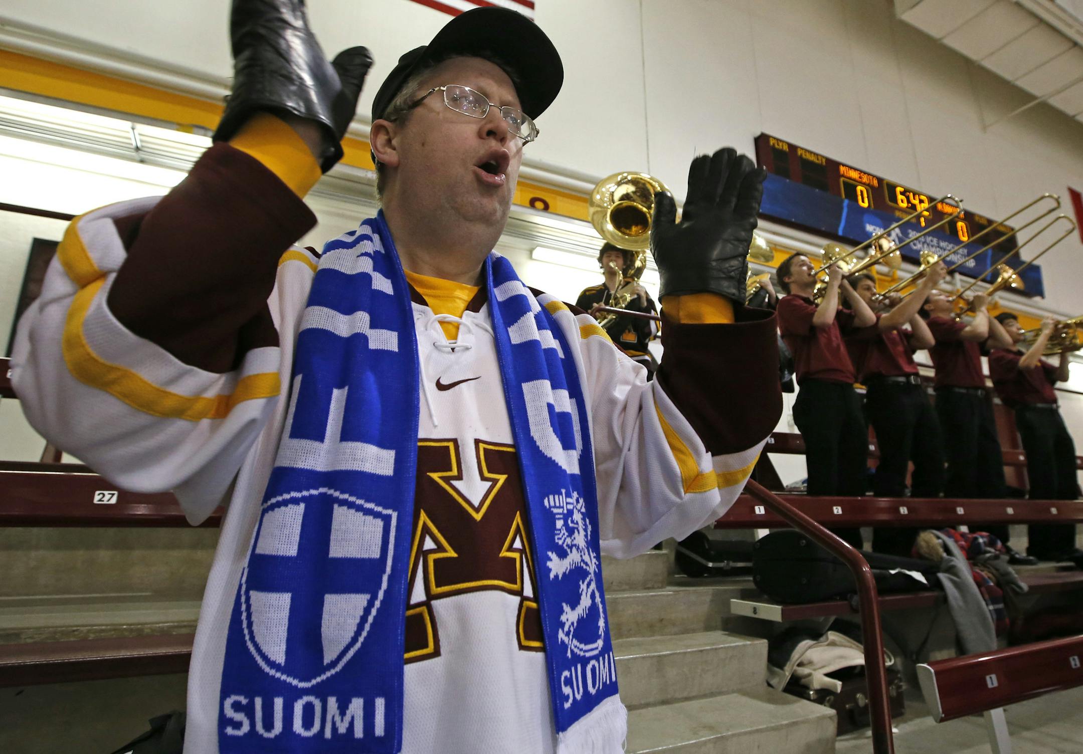 Gopher vs. North Dakota, Ridder Arena, 3/16/13. (left to right) Gopher Hockey Super Fan David Malerich cheered on the Gophers as they took the ice against North Dakota.] Bruce Bisping/Star Tribune bbisping@startribune.com FOR FUTURE STORY