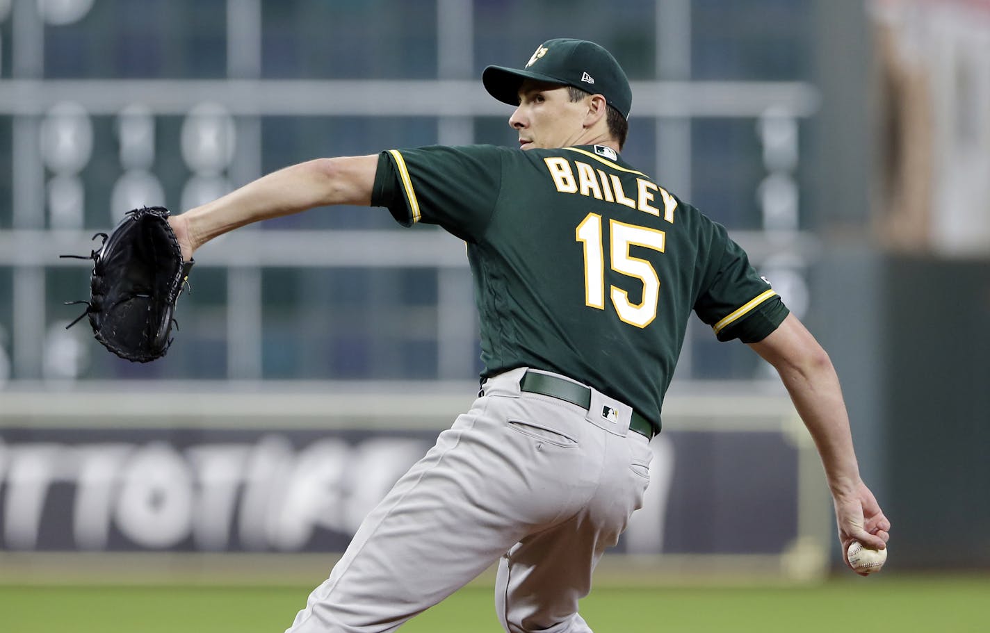 Oakland Athletics starting pitcher Homer Bailey throws against the Houston Astros during the first inning of a baseball game Thursday, Sept. 12, 2019, in Houston. (AP Photo/Michael Wyke)