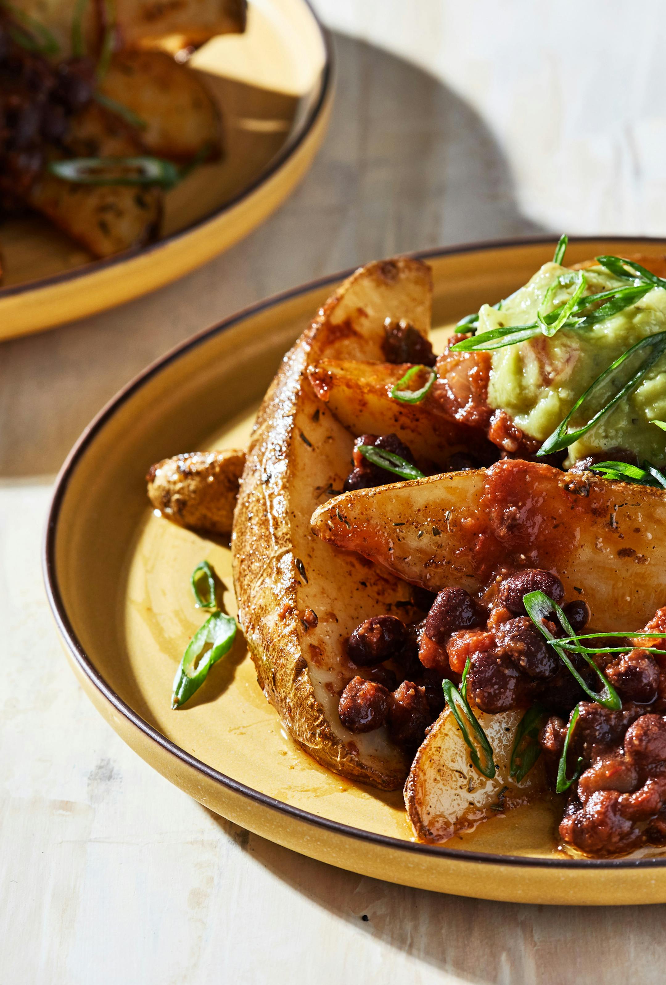 Roasted Potato Wedges With Black Bean Chili. MUST CREDIT: Photo by Stacy Zarin Goldberg for The Washington Post.