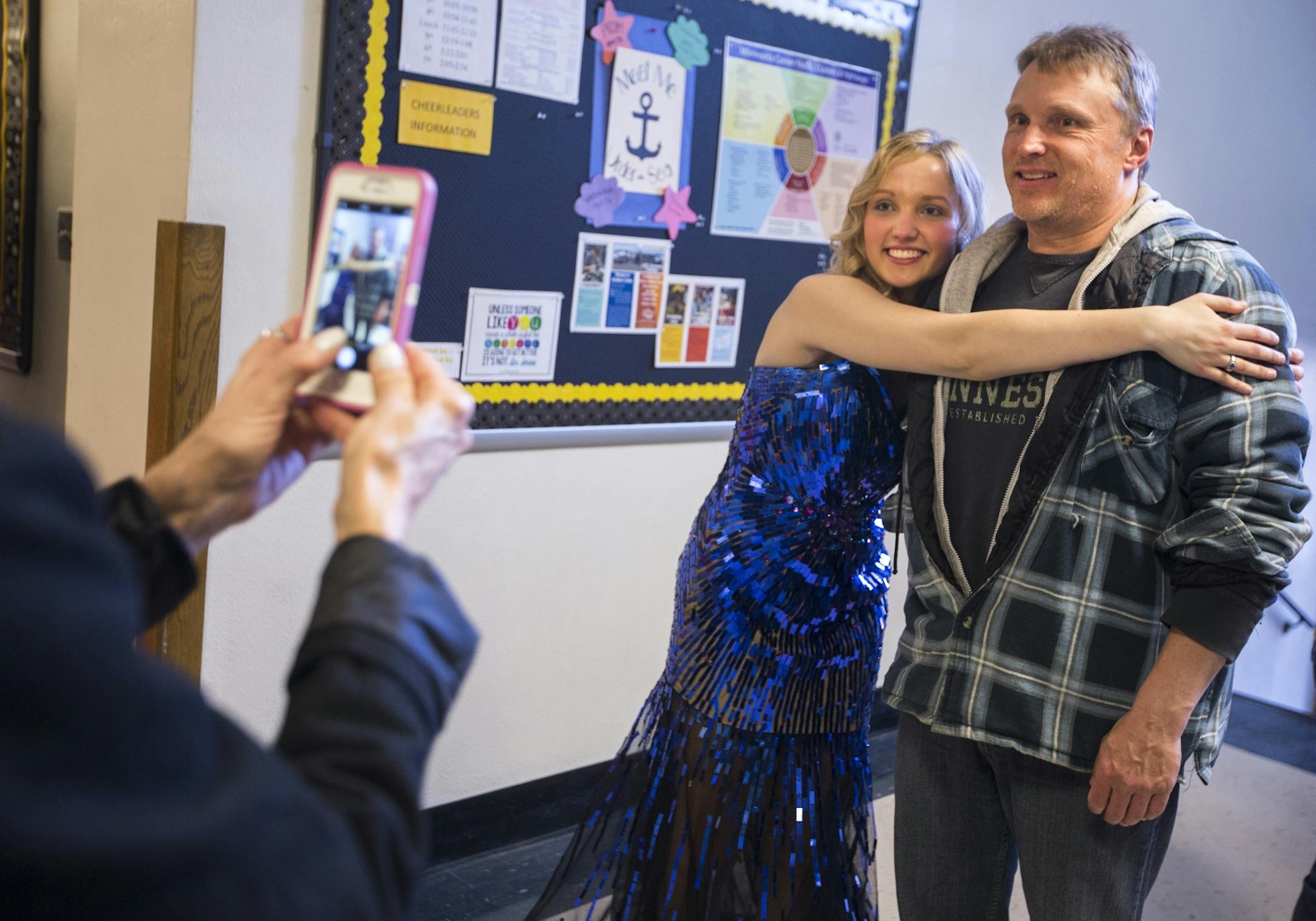 Allie Hill poses for a photo with her dad Scott Hill before prom.