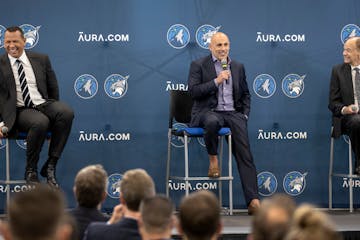 Marc Lore and Alex Rodriguez along with Timberwolves and Lynx owner Glen Taylor during a news conference Monday.