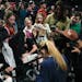 UConn guard Paige Bueckers signs autographs after Monday's win.