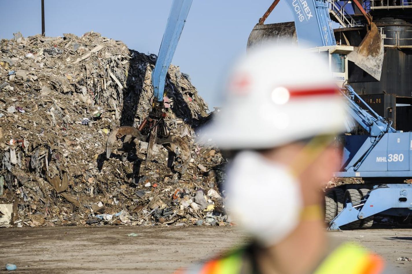 Members of the Army Corp of Engineers help remove piles of Hurricane Sandy debris remove from the Fresh Kills landfill on the Staten Island borough of New York, Nov. 14, 2012. A cleanup job on an epic scale is underway at the Fresh Kills landfill, where the New York Sanitation Department and the Army Corps of Engineers are clearing out an estimated four million cubic yards of debris.