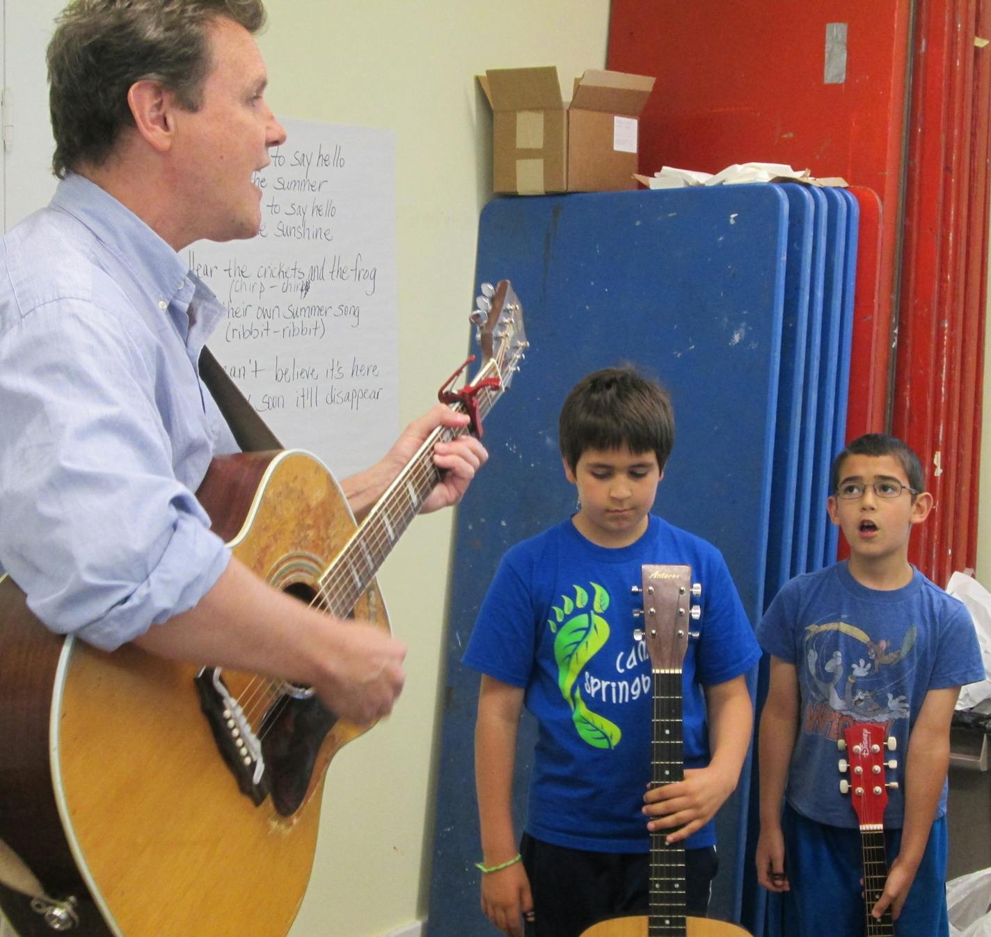 Photo by Shannon Melham: Singer-songwriter James Hersch, musician-in-residence at Anoka County libraries, with students from his workshop at Banfill-Locke Center for the Arts in Fridley.