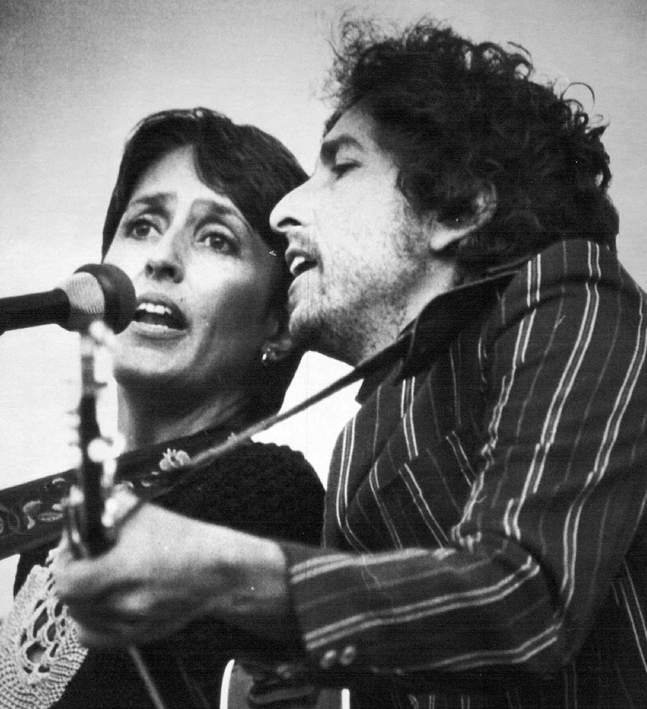 June 6,1982 Together Again�Singers Joan Baez and 8ob Dylan entertain the over 80,000 people that jammed the Rose Bowl Sunday afternoon in Pasadena, Calif. to hear music, speeches and prayers during the,"Peace Sunday,' nuclear disarmament rally. The was held just one day before the United Nations starts its special session on disarmament in New York.