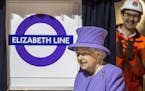 Britain's Queen Elizabeth II formally unveils the new Crossrail roundel sign for the "Elizabeth Line" which will open for passengers from December 201