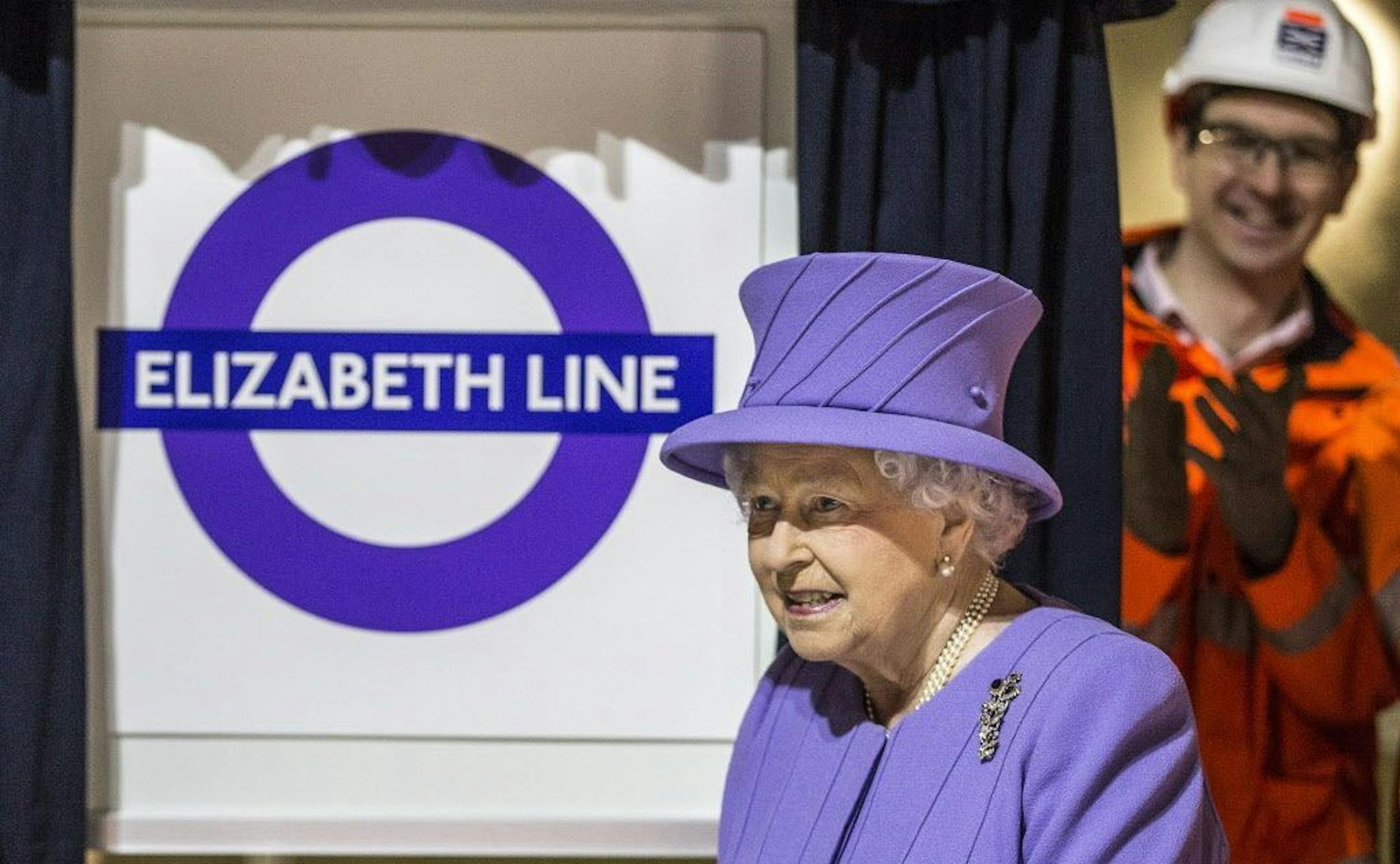 Britain's Queen Elizabeth II formally unveils the new Crossrail roundel sign for the "Elizabeth Line" which will open for passengers from December 2018. The Queen visited the site of the new Crossrail Bond street station in central London which is still under construction, on Feb. 23.