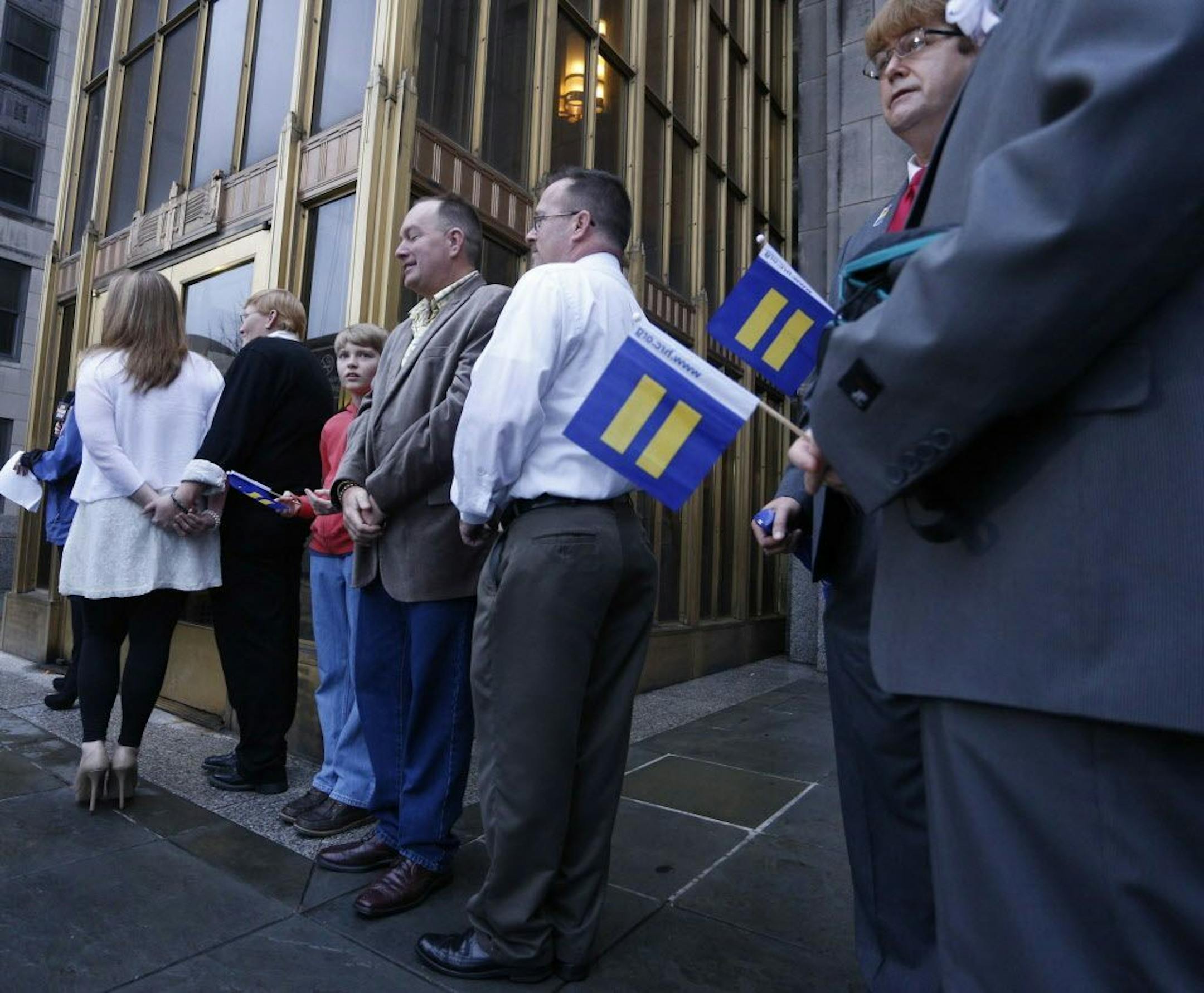 Same-sex couples wait for the Jefferson County courthouse doors to open so they can be married, Monday, Feb. 9, 2015, in Birmingham, Ala.