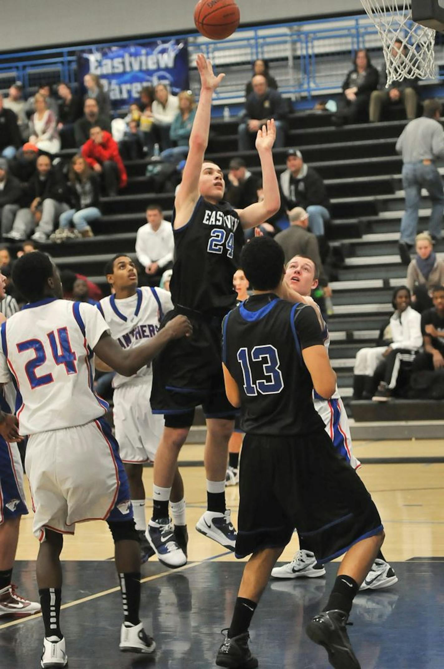 Eastview's Joey King (24) shoots in game against Spring Lake Park in December 2010. Photo provided by Mark Eliason Photography.