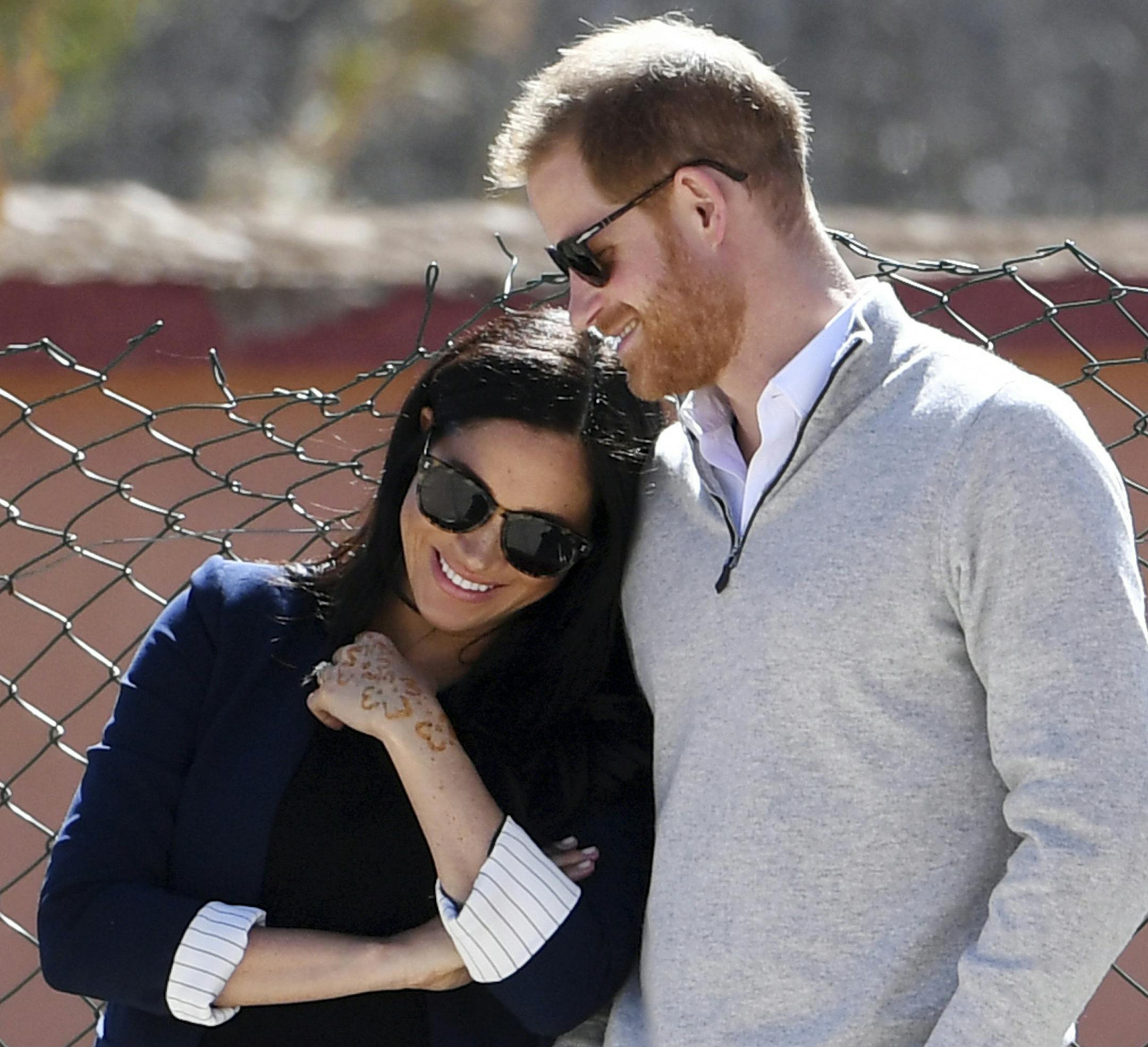 FILE - In this Sunday, Feb. 24, 2019 file photo, Britain's Prince Harry and Meghan, Duchess of Sussex, watch children playing football at a school in the town of Asni, in the Atlas mountains, Morocco. Prince Harry and Meghan, the Duchess of Sussex, may be keeping plans about their impending baby under wraps, but that hasn&#x2019;t stopped everyone in Britain from trying to guess what they&#x2019;re having - or laying a wager on the name they&#x2019;ve chosen for their first child. (Facundo Arriz