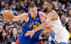 Nuggets center Nikola Jokic still had 32 points and eight rebounds in Game 1 Saturday, but the defense of Rudy Gobert, along with Karl-Anthony Towns a