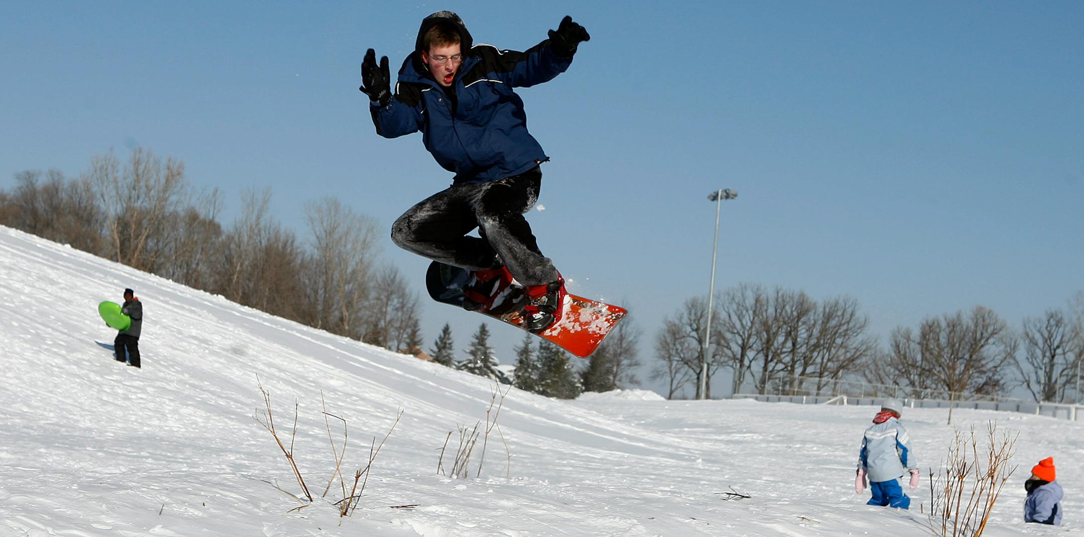 Cory Yackel enjoyed snowboard Monday at Central Park in Brooklyn Park. About 3-4 inches of snow fell in the metro area yesterday.