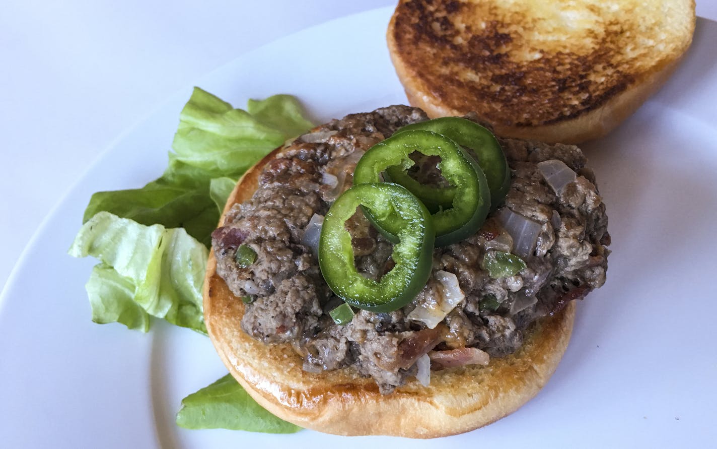 Cowboy Burgers with jalape&#xf1;o, bacon and Cheddar.