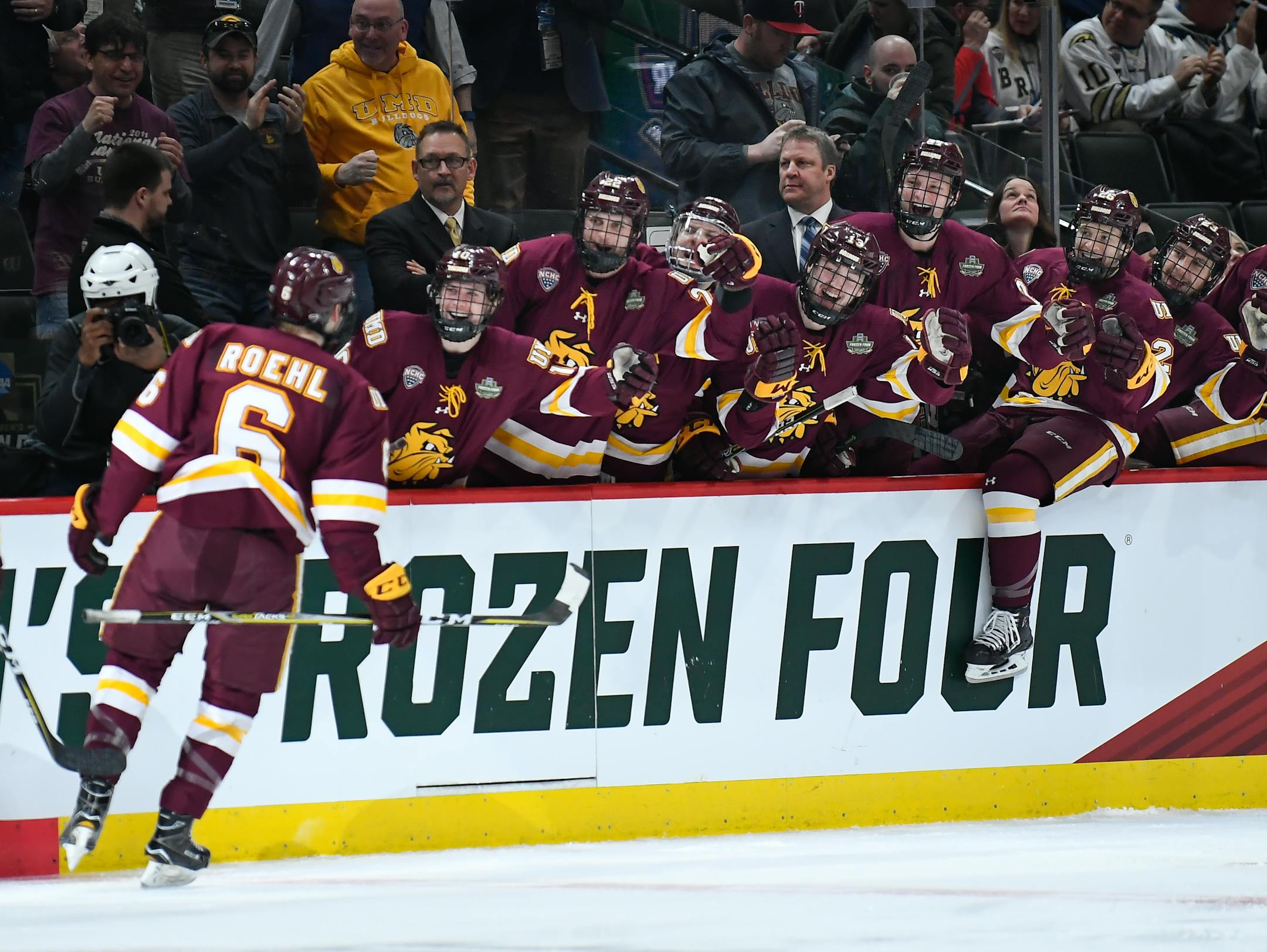 Teammates celebrated with Minnesota Duluth defenseman Louie Roehl after his first-period goal against Ohio State