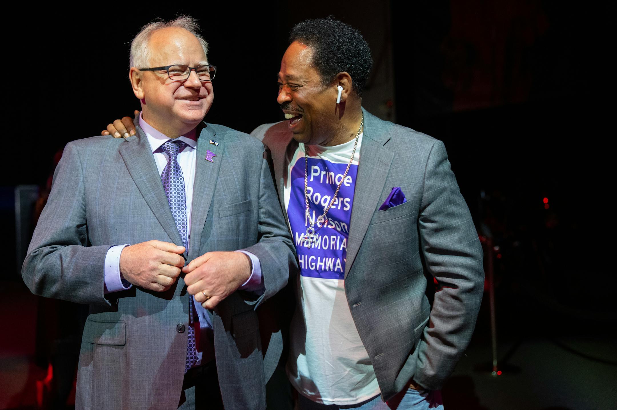 Minnesota Governor Tim Walz and Mark Webster, a major advocate for the bill, share a laugh before the bill signing ceremony.