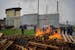Prison workers burn wooden pallets during a protest in front of the Corbas prison, outside Lyon, France, Wednesday, May 15, 2024.