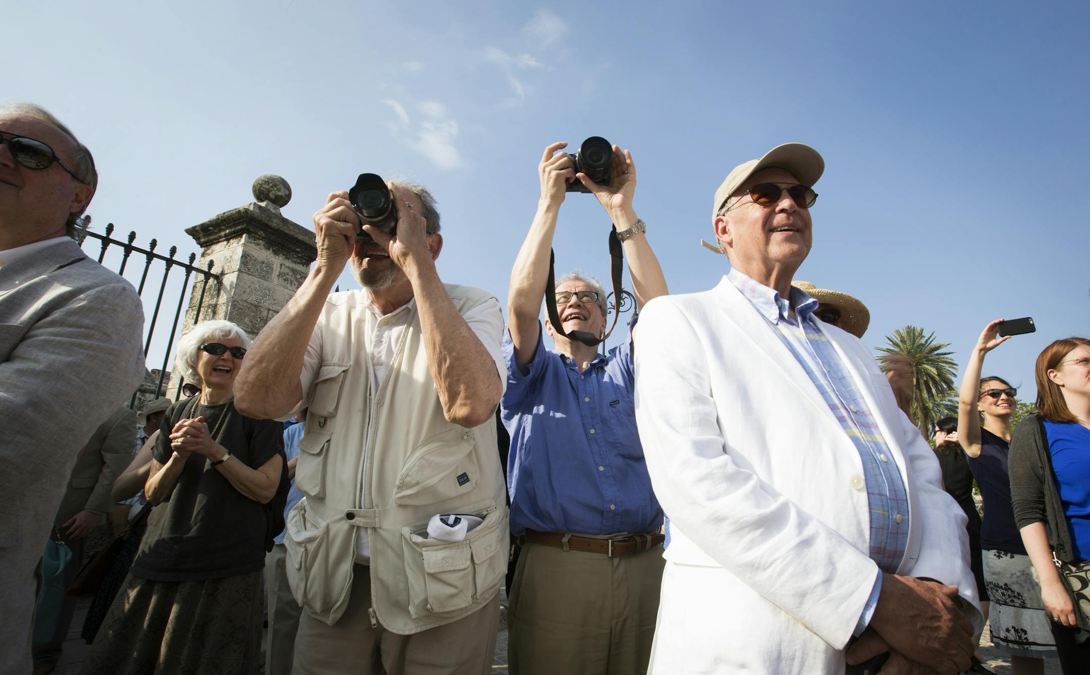 Minnesota Orchestra music director Osmo Vanska, center, takes a photo as dancers and musicians greet the Minnesota Orchestra in Plaza de Armas in Havana, Cuba on Wednesday, May 13, 2015.