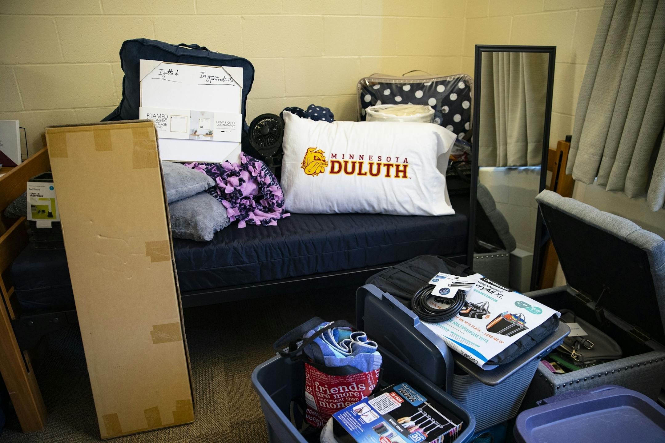 Riley Krenz, an freshman Chemistry major from Rosemount, MN, stacked all her belongings on her bed and the floor as she moved into her room in Ianni Hall at UMD on Thursday.